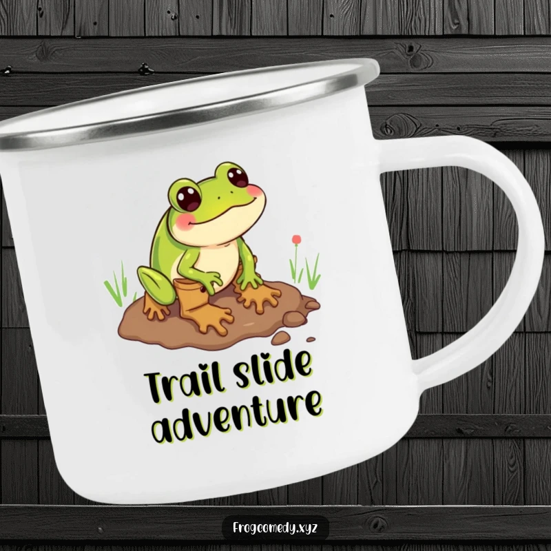 Funny camping mug showing a frog wearing boots comically sliding through mud, ideal for cheerful outdoor trips.