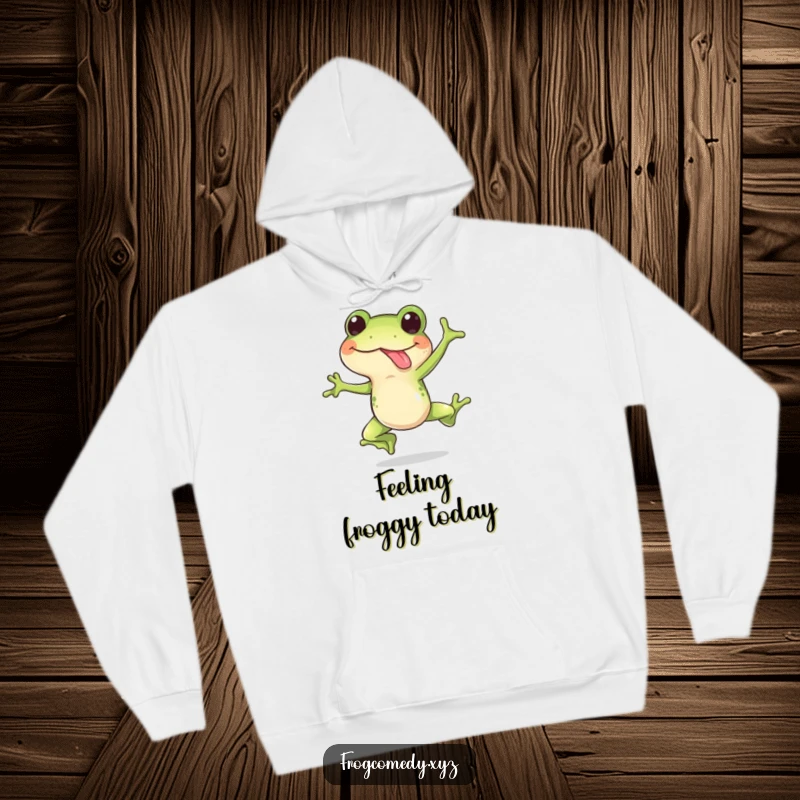 Funny hoodie featuring a happy frog doing a surprise leap with its tongue out, offering cozy and humorous amphibian vibes.