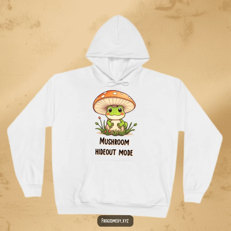 Funny Kawaii frog hoodie featuring a cute frog peeking out from behind a mushroom, perfect for cozy, humorous days.