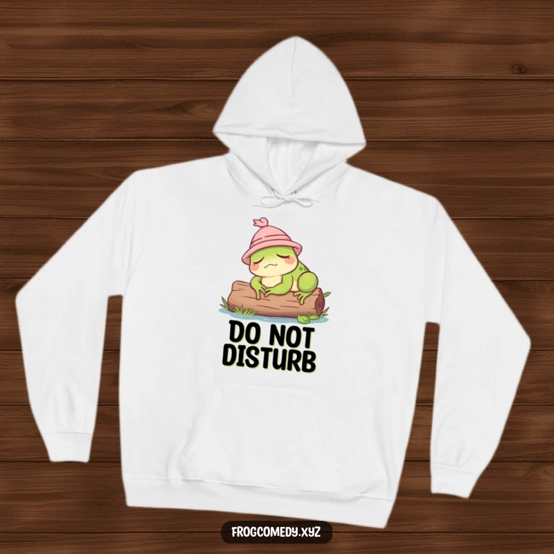 Funny hoodie featuring a very sleepy frog wearing a cute hat while resting on a log.