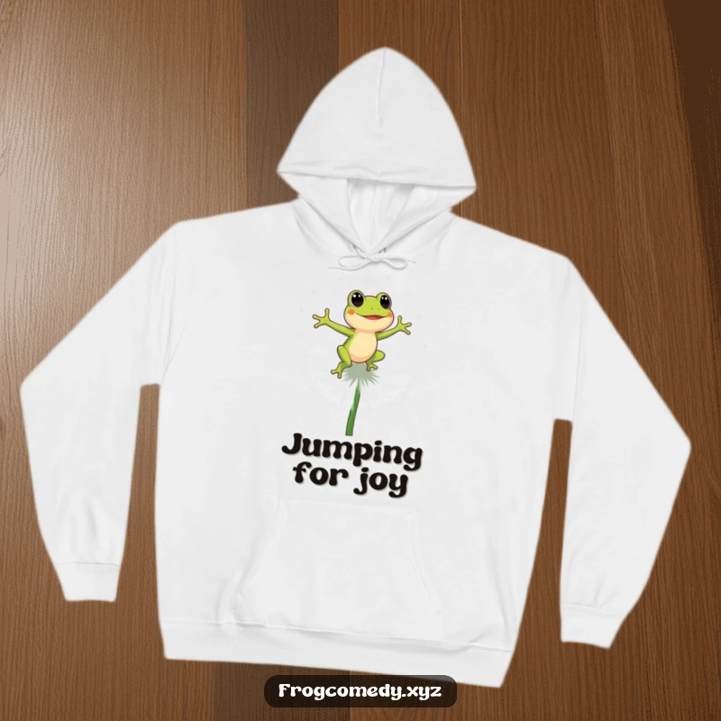 Funny energetic frog bouncing on a big dandelion puff, warm hooded sweatshirt, cute cartoon animal, funny gift for nature lovers.
