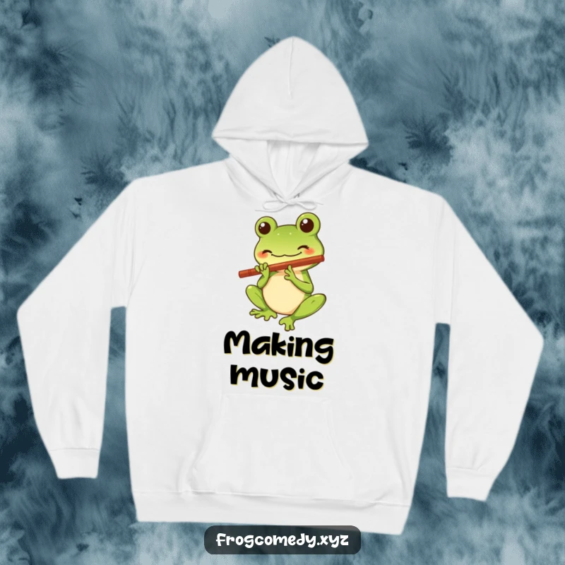 Funny Kawaii frog hoodie featuring a stylized character with a big smile playing a tiny flute, offering warmth and a dose of cute, musical humor.