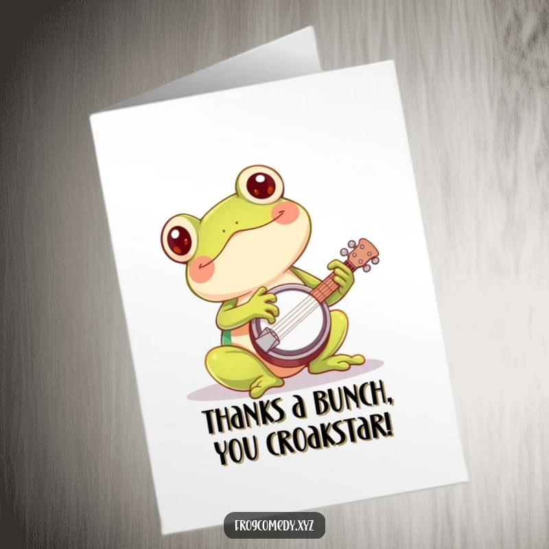 Funny Free Printable Thank You Card: a content Kawaii frog joyfully playing a tiny banjo to express thanks.