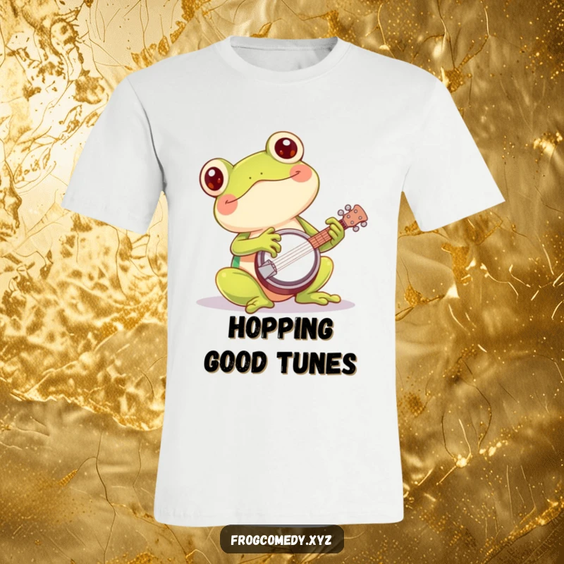 Funny kawaii frog t-shirt showing a cute amphibian playing a miniature banjo with great enthusiasm and a happy expression.